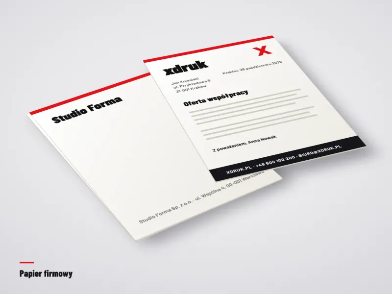 Papier firmowy A4 z logo i adresem firmy obok pióra